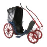PONY PHAETON, or invalid carriage. In blue on maroon/red running gear, lined black. Leather head and
