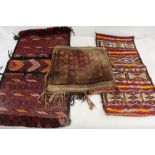 Three Afghan Baluchi saddle or salt bags, all with geometric decoration, 43cm, 70cm and 80cm