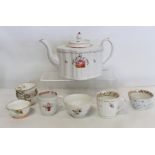 New Hall porcelain teapot of "silver" or "commode" shape, with painted decoration of a basket of