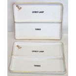 Two white porcelain rectangular trays with central partition, one side inscribed "spirit lamp",
