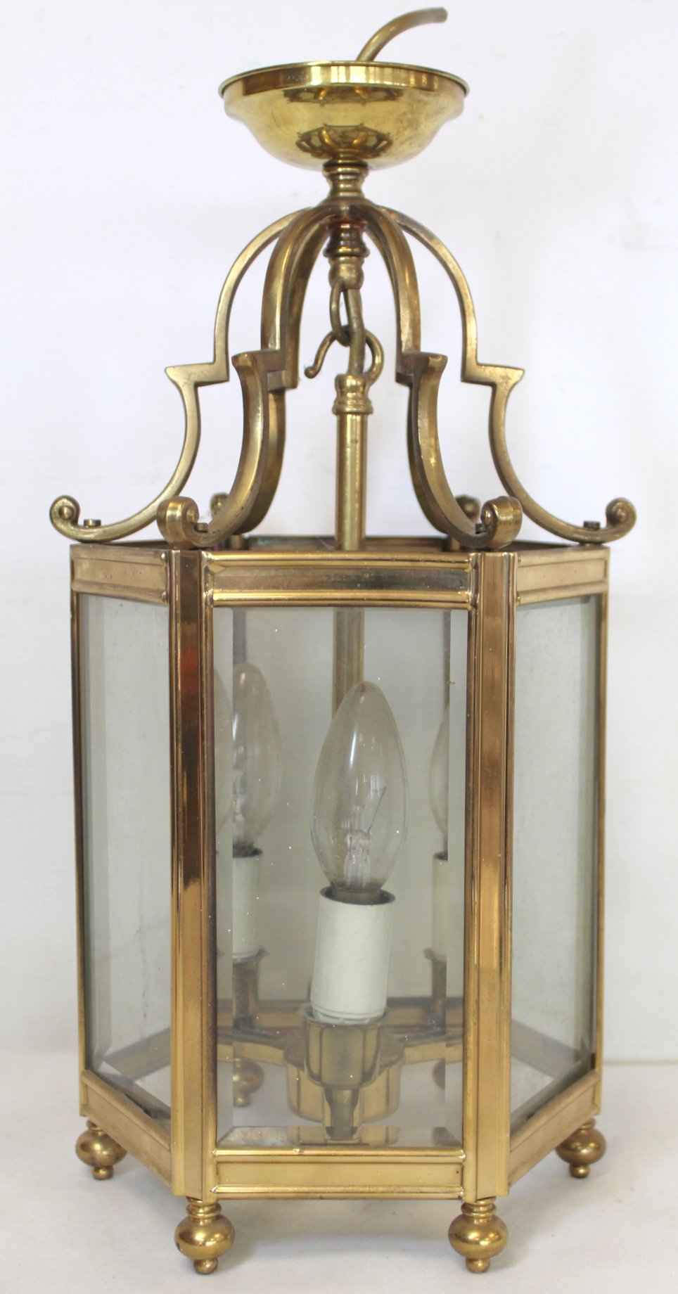 Georgian style brass hall lantern of hexagonal form with bevelled glass panels, domed scroll - Image 2 of 4
