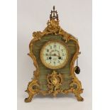 Mantel clock by Marti, Paris, with florally decorated dial in ormolu mounted queen onyx marble