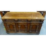 Jacobean style oak coffer by Titchmarsh & Goodwin of Suffolk, with a hinged top above a carved