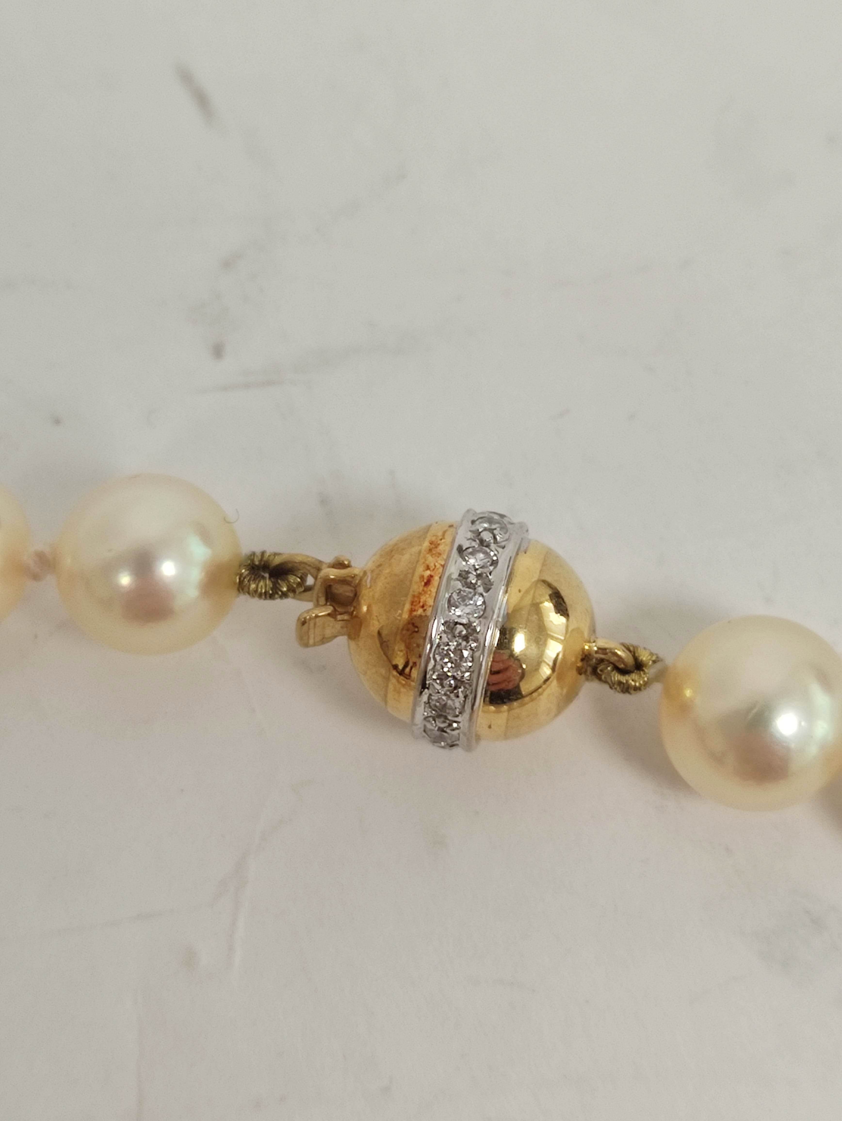 Necklace of equal sized cultured pearls, opera length on diamond set gold ball snap '.750'. - Image 3 of 6