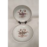 Pair of Chinese Yuan style white glazed dishes with moulded phoenix decoration and applied