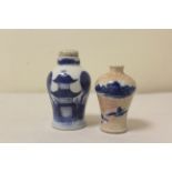 Two Chinese porcelain snuff bottles to include a blue and white bottle decorated with a landscape