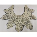 Victorian lace collar of lobed form with foliate scroll decoration, 60cm wide.