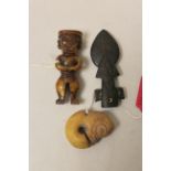 Three Chinese archaic and archaised jade figures to include a dark jade carving of spearhead form,