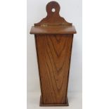 Georgian elm hanging candle box of tapered rectangular form with arched pierced box and sloping