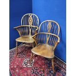 Pair of near matching ash and elm Windsor armchairs, both with spindle hoop back, with pierced splat