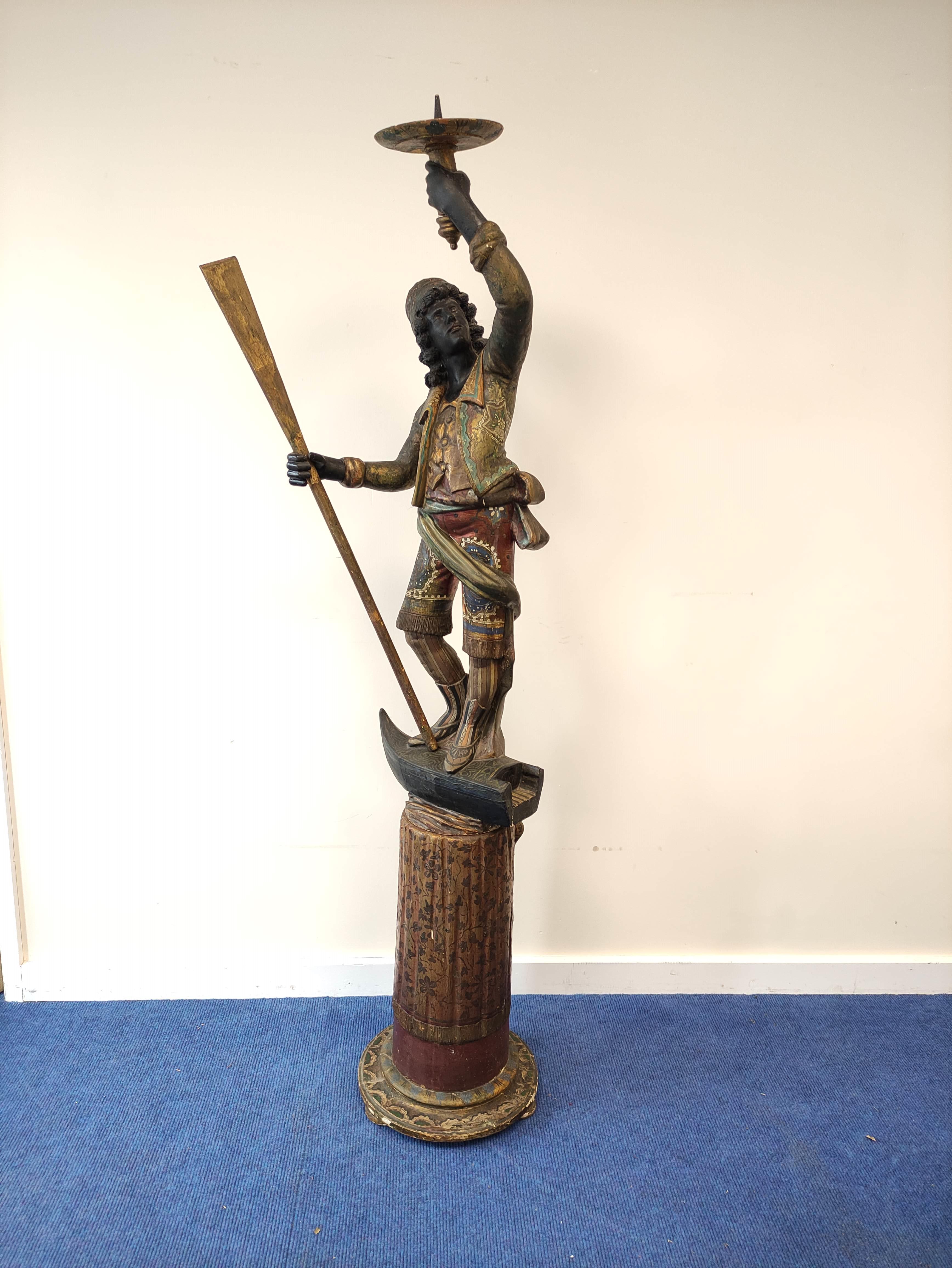 Italian Venetian polychromed gilt wood Blackamoor figure, modelled as a large figure standing on a