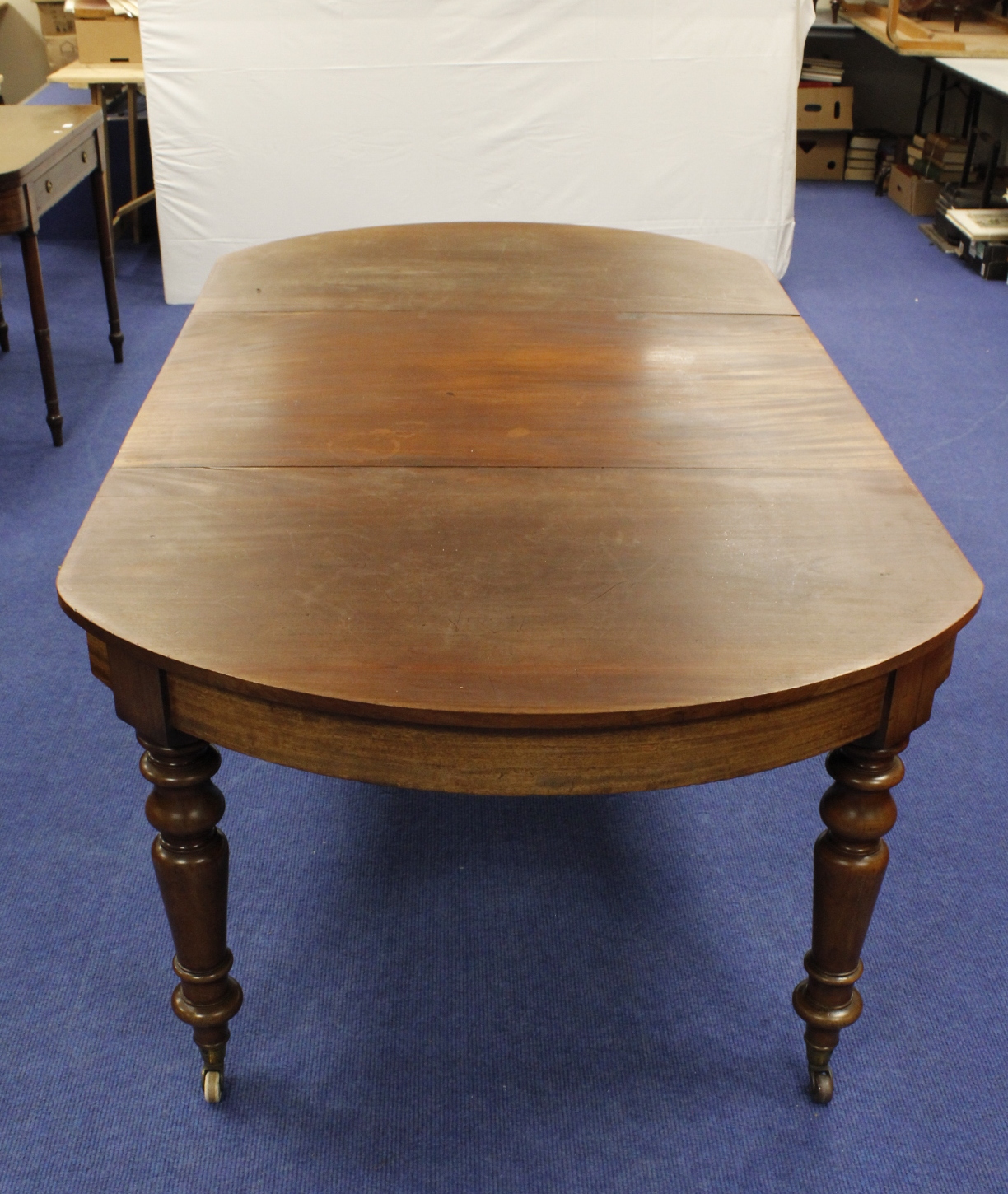 19th century mahogany dining table with curved D ends