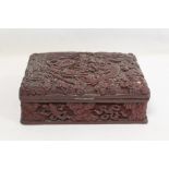 Chinese cinnabar lacquer lidded box of rectangular form with carved decoration of a five clawed
