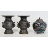 Pair of Japanese Meiji period small twin handled bronze vases, with panels of birds and turtles