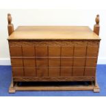 Michael Gibbon 20th century carved wooden cradle of box form on two shaped upright supports