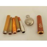 Silver sovereign purse, Birmingham 1905, a French amber cheroot holder with gold mounts and