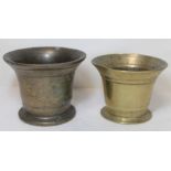 Antique bronze mortar of flared circular form, 15cm diam. and another smaller, 13.5cm diam.  (2).