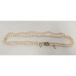 Two row necklace of cultured pearls on similar 9ct gold snap.
