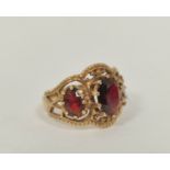 Garnet three stone ring in 9ct gold. Size 'O'.