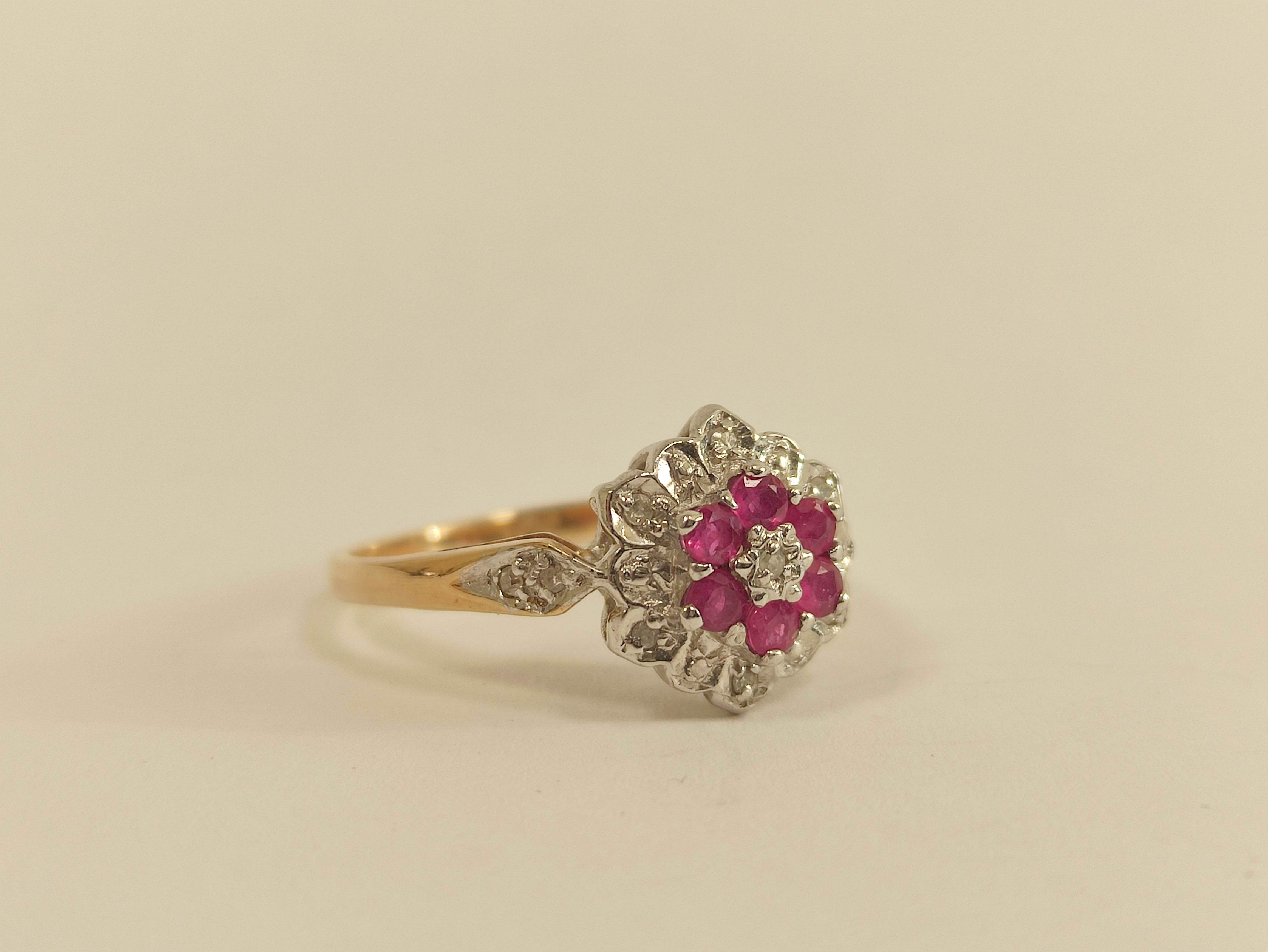 Diamond and ruby cluster ring in 9ct gold. Size 'P'.