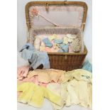 Vintage wicker baby layette basket lined in pink gauze with ribbon decoration and lift out tray,