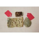 Three Chinese archaic and archaised jade carvings, to include a green jade stone with a dragon