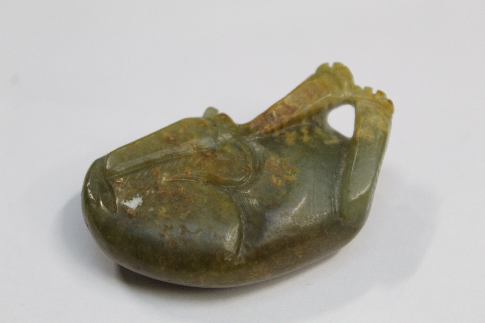 Three Chinese archaic and archaised jade figures to include a repose cat figure, a rectangular - Image 8 of 14