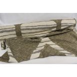 Edinburgh Weavers/Morton Sundour roll of "Karima" pattern jacquard woven fabric in brown and cream.