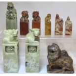 Collection of eight Chinese carved stone seals with various finials in the form of figures and