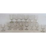 Collection of fourteen antique drinking glasses with rounded bucket bowls on plain stems and
