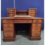 Victorian mahogany Dickens desk with a balustrade decorated shelve flanked with four small