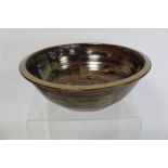 Harry and May Davis Crowan Cornish studio pottery bowl of circular form with tenmoku glaze and wax