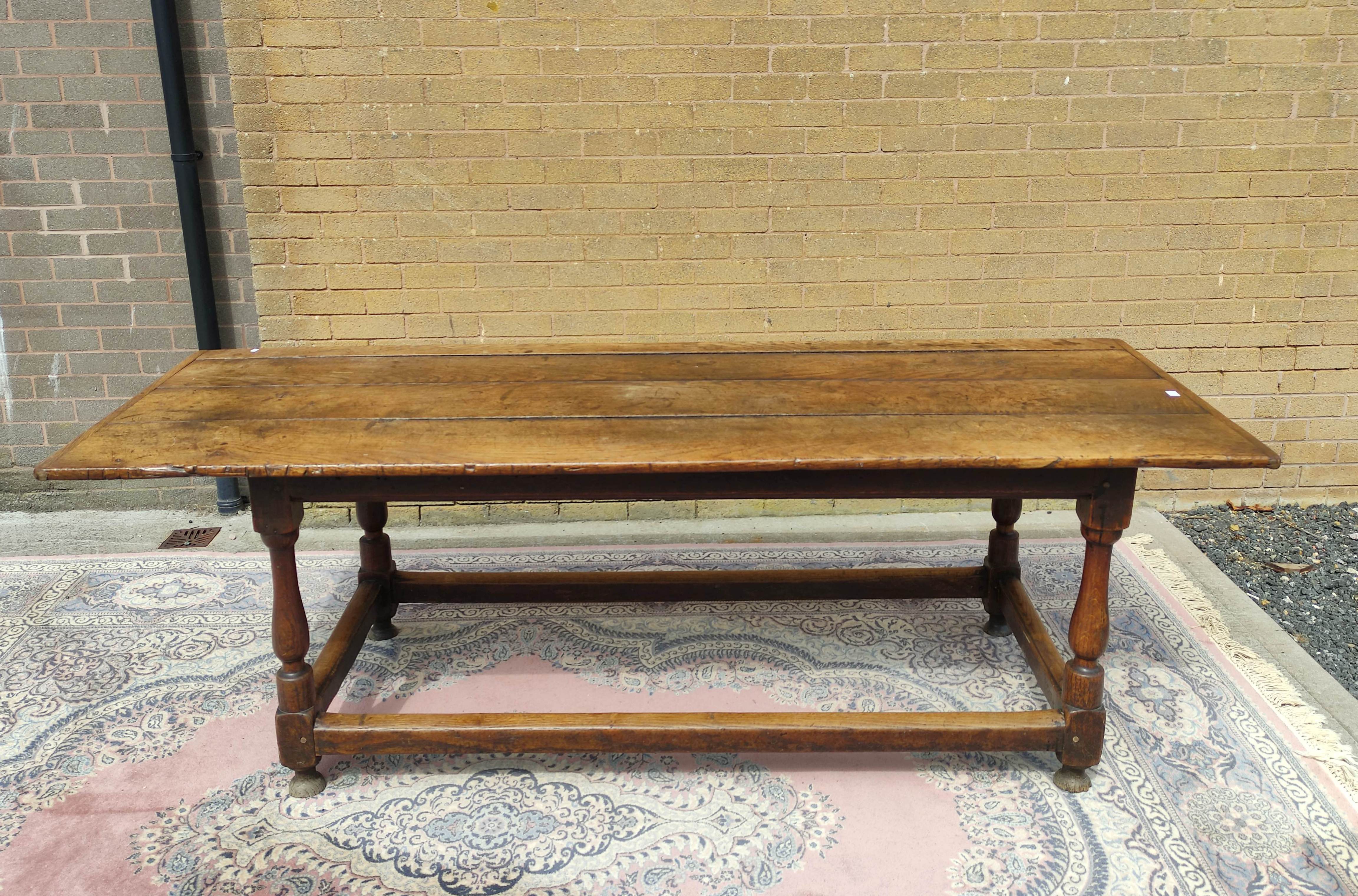 Antique oak and elm refractory dining table with cleated plank top on turned and block supports