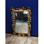 George III design 19th century gilt wood wall mirror, decorated with Griffins and floral scrolls.