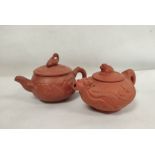 Two Chinese Yixing teapots, one decorated with moulded bird decorations with crane lid, marks to
