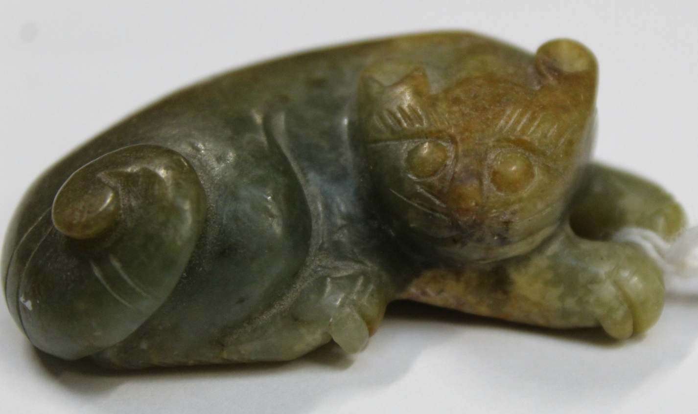 Three Chinese archaic and archaised jade figures to include a repose cat figure, a rectangular - Image 14 of 14