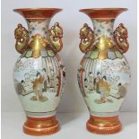 Pair of Japanese Meiji period Kutani vases of twin handled baluster form with panels depicting