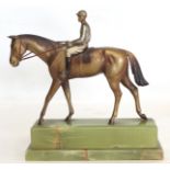 Early 20th century Austrian cold painted bronze figure of a racehorse and jockey on stepped green