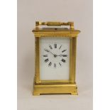 French carriage clock, quarter repeating, with silvered platform and compensated balance, in gilt