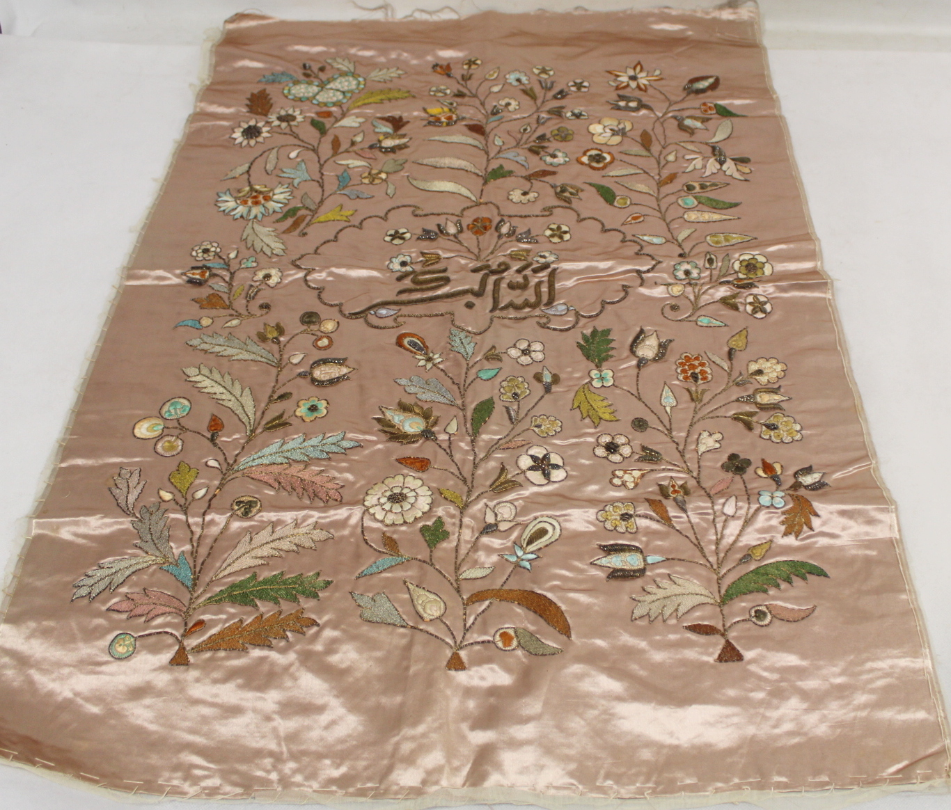 19th or early 20th century Persian embroidered silk panel, the pale pink ground with central panel