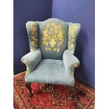 Chippendale style wing armchair upholstered in floral needlepoint and velour, raised on cabriole