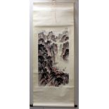 Two Chinese reproduction scroll paintings (prints), one depicting a mountainous river gorge with