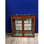 George III style display cabinet, with two glazed doors enclosing later glass shelves, with brackets