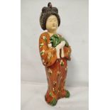 Large Chinese sancai pottery figure of a Tang dynasty court lady with lapdog, 64cm high.