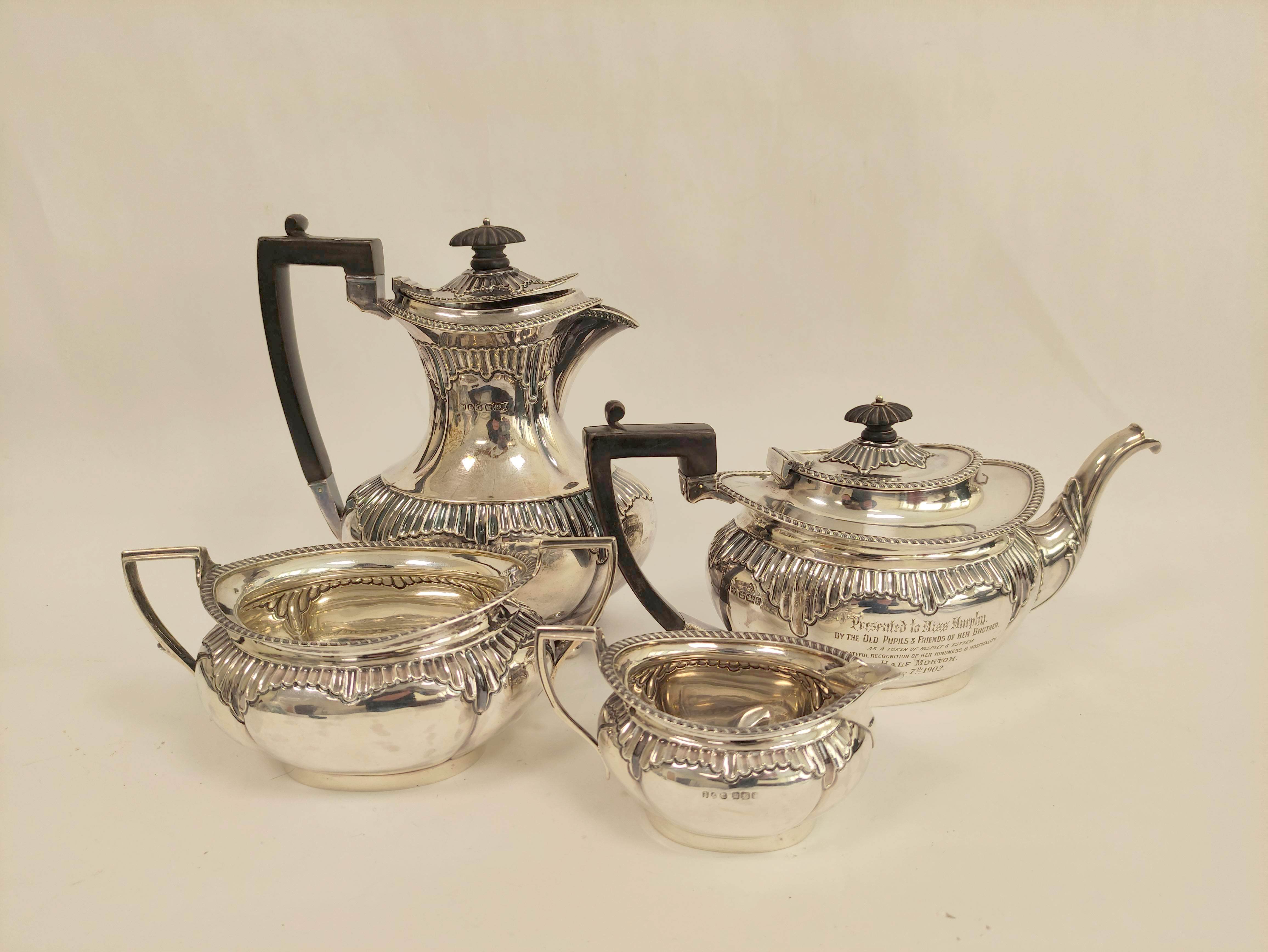 Silver four-piece tea set, oval part fluted, inscribed 'Half Morton 1902', Sheffield 1901. 1464g/