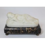 19th century carved white marble figure of a sleeping putto on black, orange and white veined marble