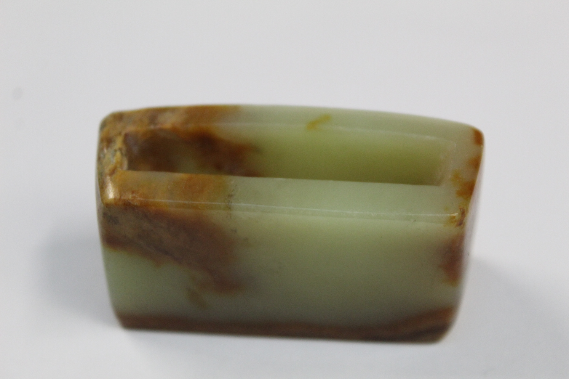 Three Chinese archaic and archaised jade figures to include a repose cat figure, a rectangular - Image 11 of 14