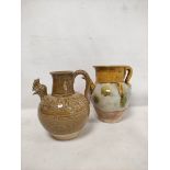 Early Chinese, possibly Tang dynasty, pottery ewer, part yellow glazed, 18cm high and a brown glazed