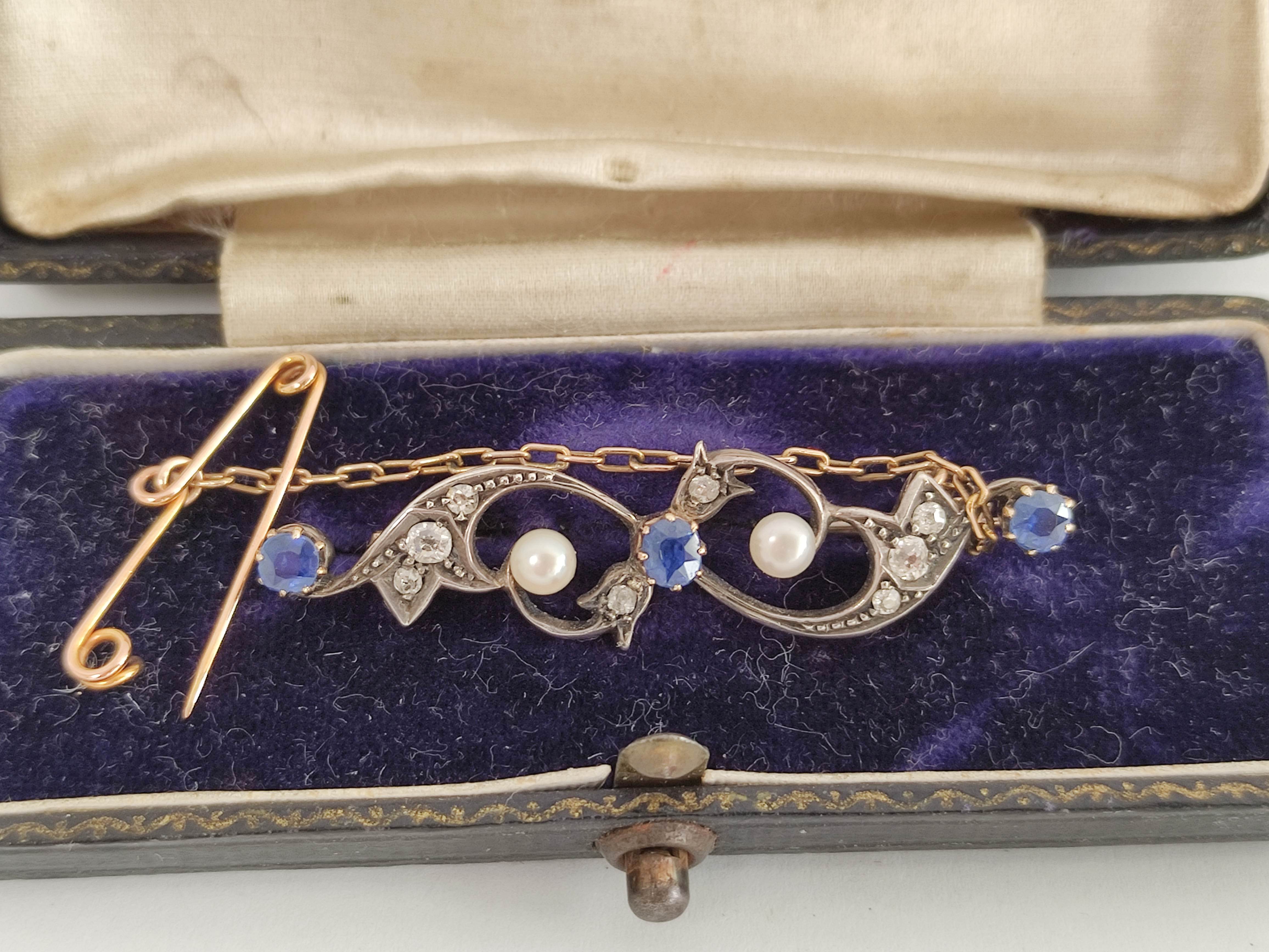 Edwardian gold brooch with scrolls of three sapphires and diamonds in gold and silver. - Image 2 of 6