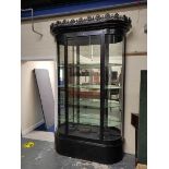 Antique ebonised shop cabinet, with gothic style trellis pediment above a glazed door enclosing